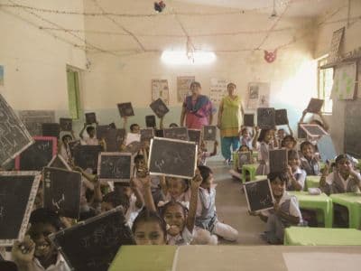 Children in a rural school smiling